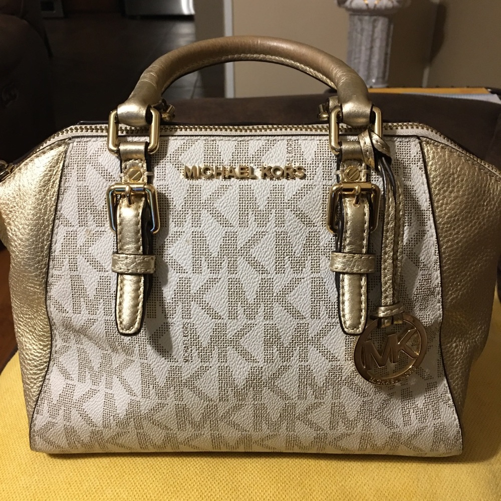 One Micheal Kors small purse very nice. Buy purse get wallet for $20 well kept.